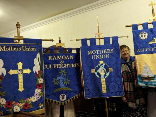 Rev Louise Stewart pictured with the 4 banners she has made for branches in North Connor.